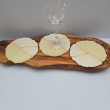 Load image into Gallery viewer, Ivory &amp; Gold Resin Coaster Set of Three – Handmade Elegance
